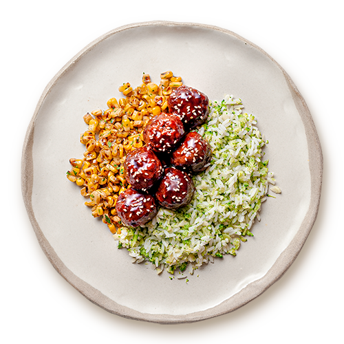 Plant-based meatballs with sautéed corn & rice with broccoli